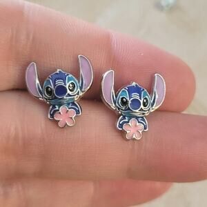 Stitch themed enamel post earrings with flower